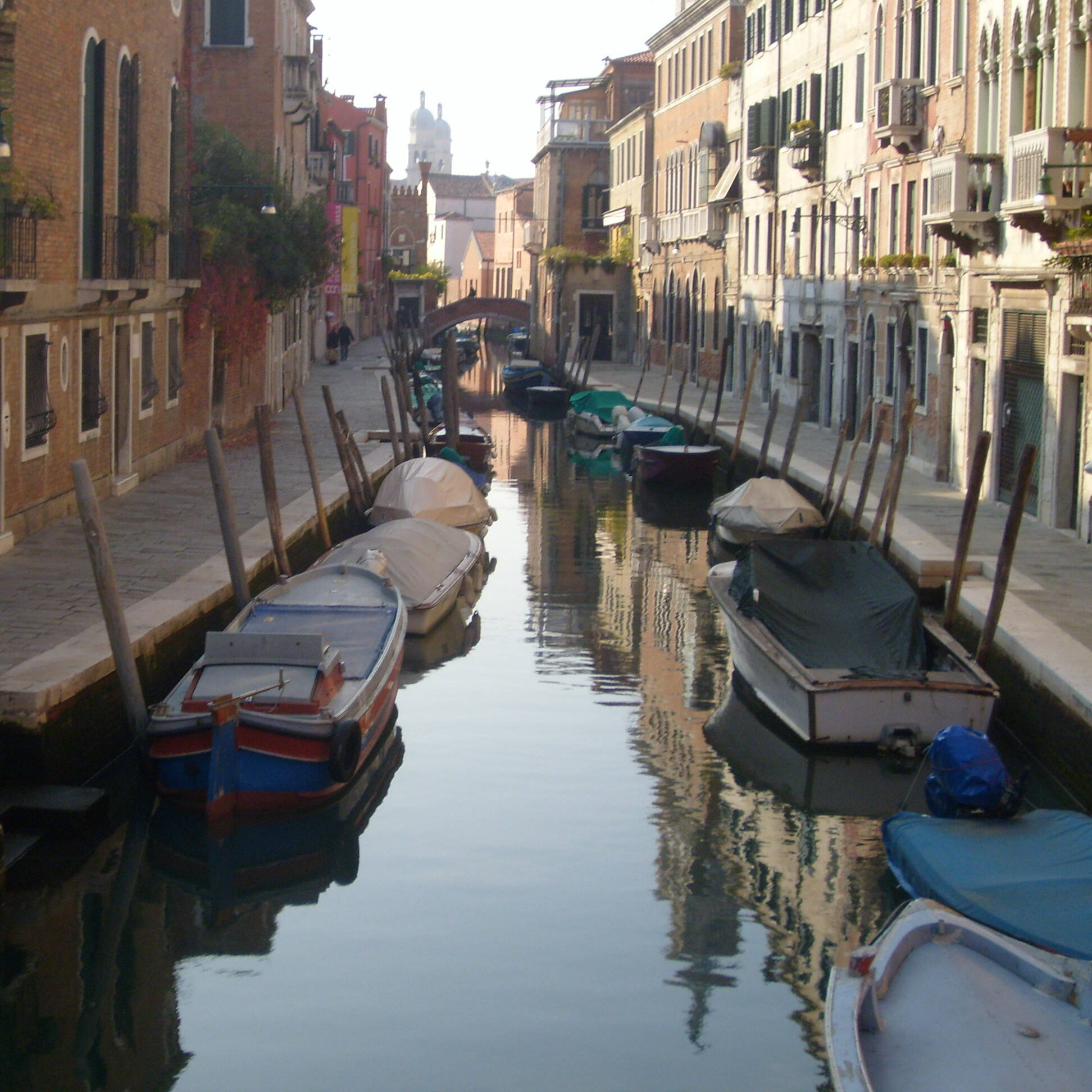 Canal with boats in Venice, Italy